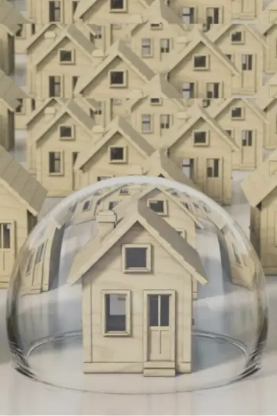 Image showcasing safeguarding your home: A house in a bubble surrounded by other houses, representing mortgage protection life insurance.